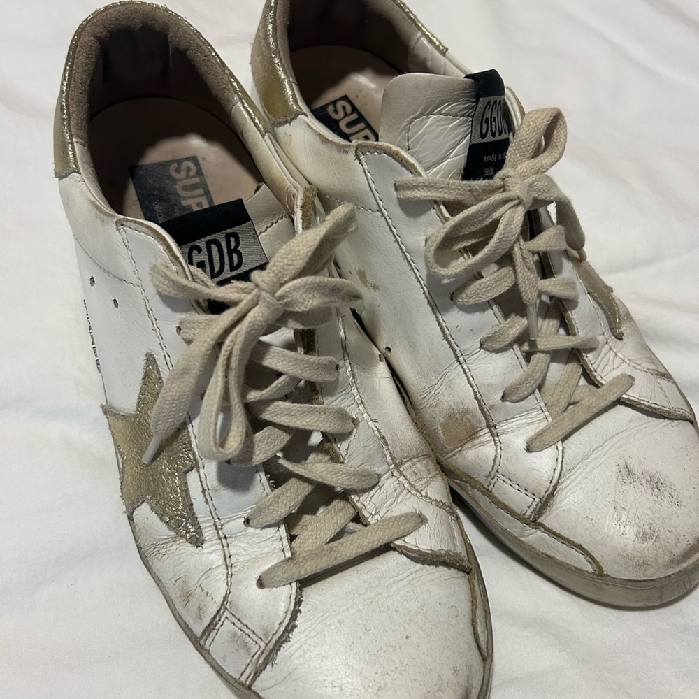 Golden Goose Distressed White and Gold Sneakers